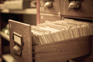 Image of vintage file cabinet filled with documents